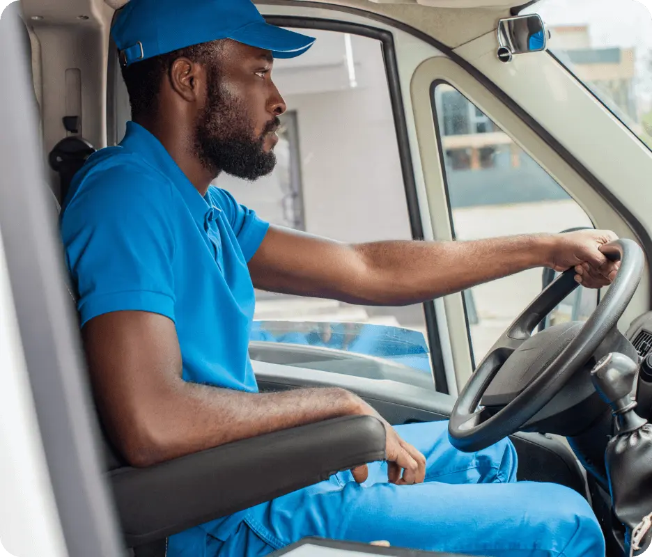 Delivery driver sitting in a van to make deliveries